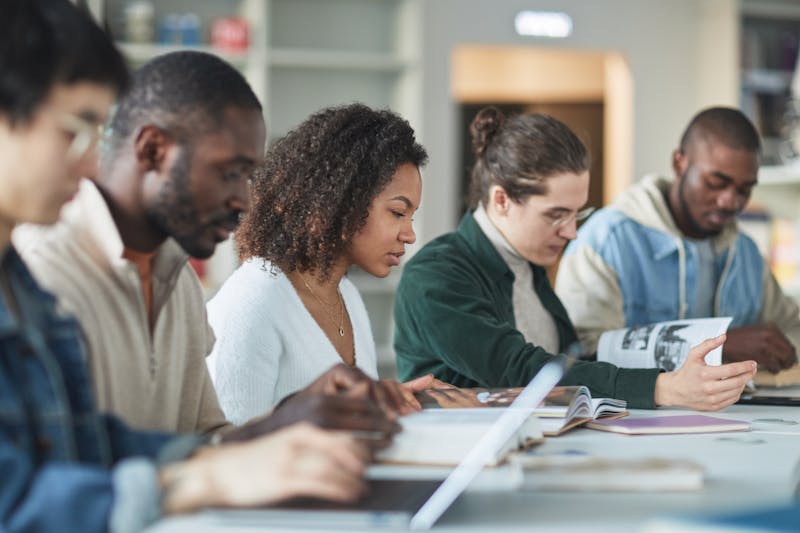 A diverse group of international students studying together at a university